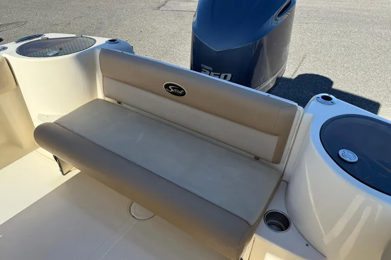 Slide: The Image of 2012 Scout 240 Bay Scout boat interior with seating and Yamaha 350 engine. - 28