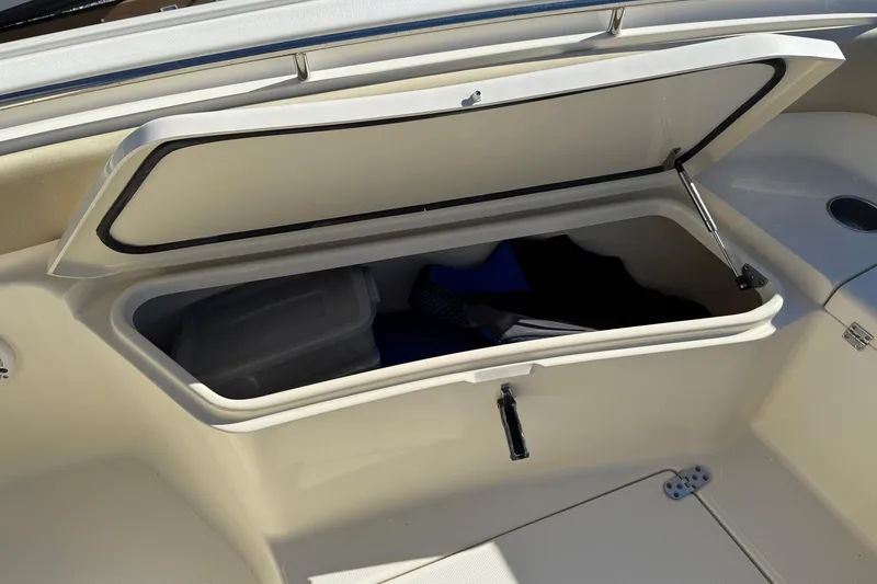 Slide: The Image of Open storage compartment on a 2012 Scout 240 Bay Scout boat. - 8