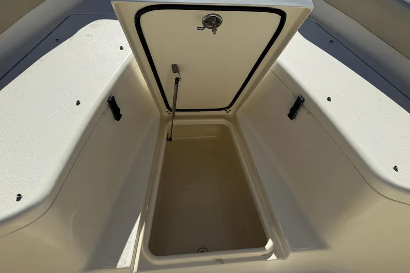 Slide: The Image of Open storage compartment on 2012 Scout 240 Bay Scout boat. - 9