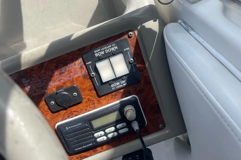 Slide: The Image of Control panel of a 1997 Bayliner 2655 Ciera boat with trim tab switches. - 17