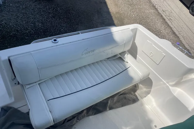 Slide: The Image of 1997 Bayliner 2655 Ciera boat interior with white cushioned seating. - 9