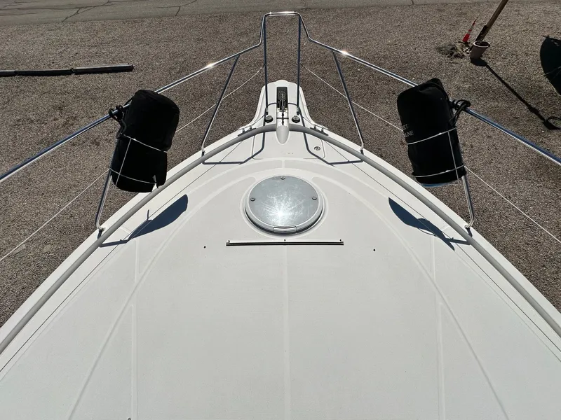 Slide: The Image of 2004 Silverton 38 Convertible boat deck with railings and hatch. - 13