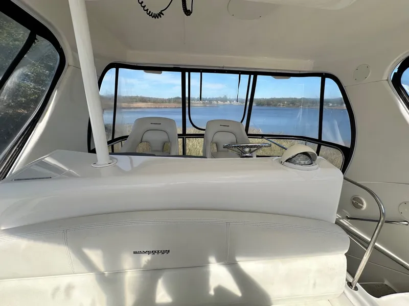 Slide: The Image of Interior of 2004 Silverton 38 Convertible yacht with scenic water view. - 20