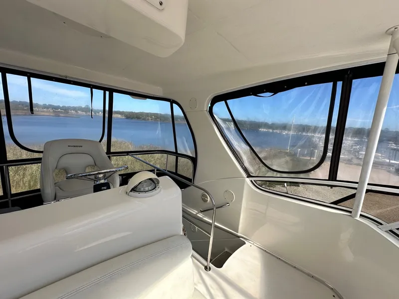 Slide: The Image of Interior view of 2004 Silverton 38 Convertible yacht with scenic water backdrop. - 22