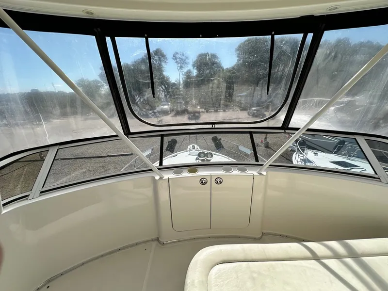 Slide: The Image of 2004 Silverton 38 Convertible yacht interior with panoramic windows and seating area. - 24