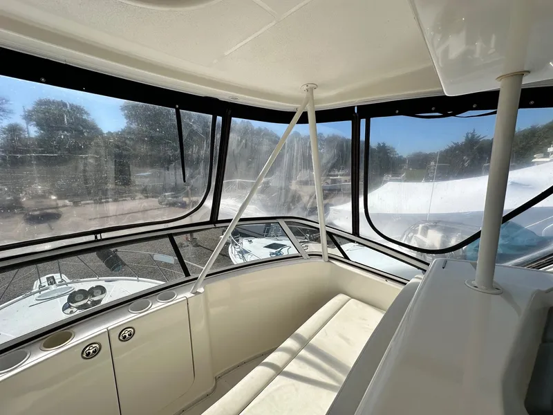 Slide: The Image of Interior view of 2004 Silverton 38 Convertible yacht with panoramic windows. - 26