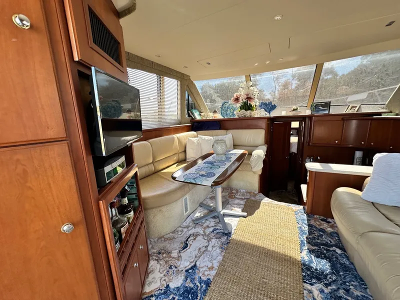 Slide: The Image of Luxurious interior of 2004 Silverton 38 Convertible yacht with elegant seating and decor. - 35