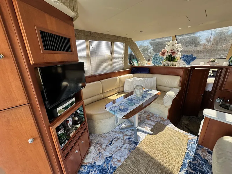 Slide: The Image of Luxurious interior of 2004 Silverton 38 Convertible yacht with elegant decor and seating. - 36