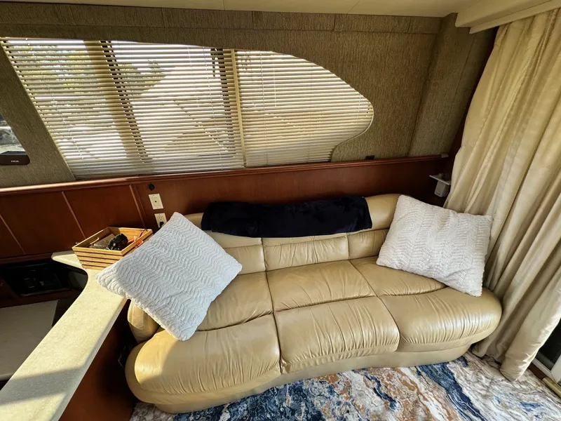 Slide: The Image of Luxurious interior of 2004 Silverton 38 Convertible yacht with plush seating and elegant decor. - 38