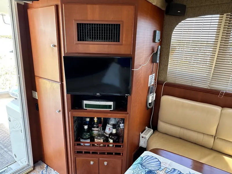 Slide: The Image of Interior of 2004 Silverton 38 Convertible yacht with TV and bar area. - 39