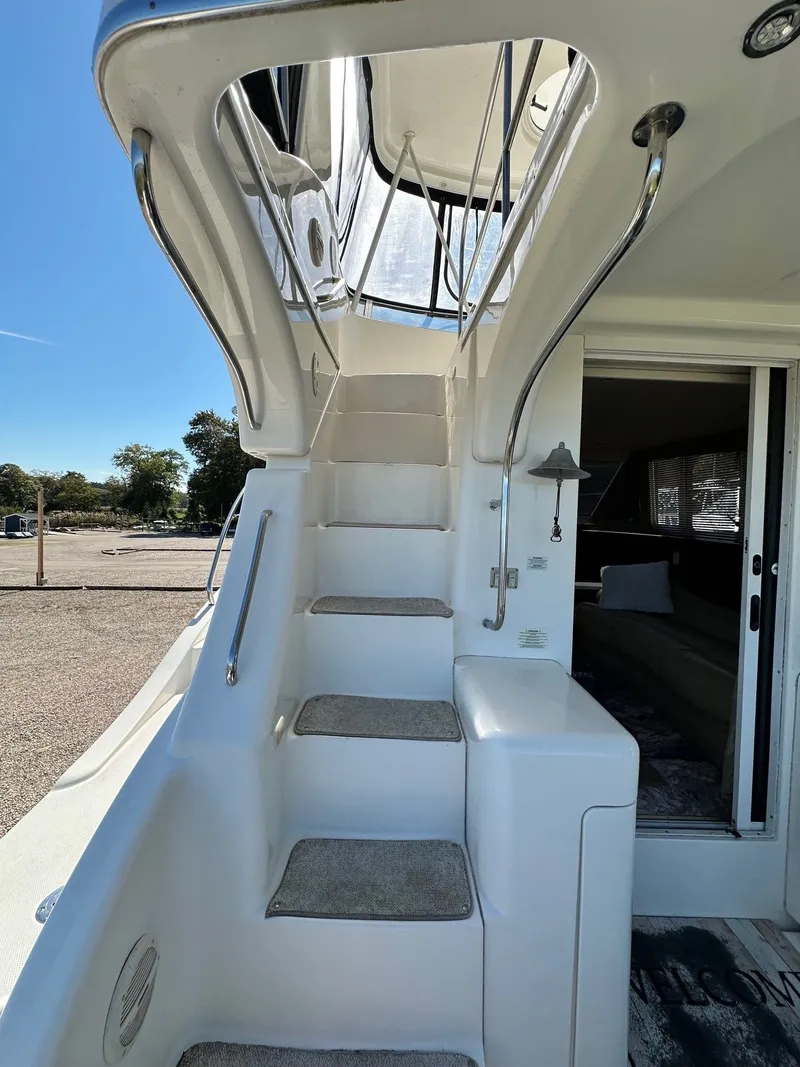 Slide: The Image of Staircase on a 2004 Silverton 38 Convertible yacht, leading to the upper deck. - 8