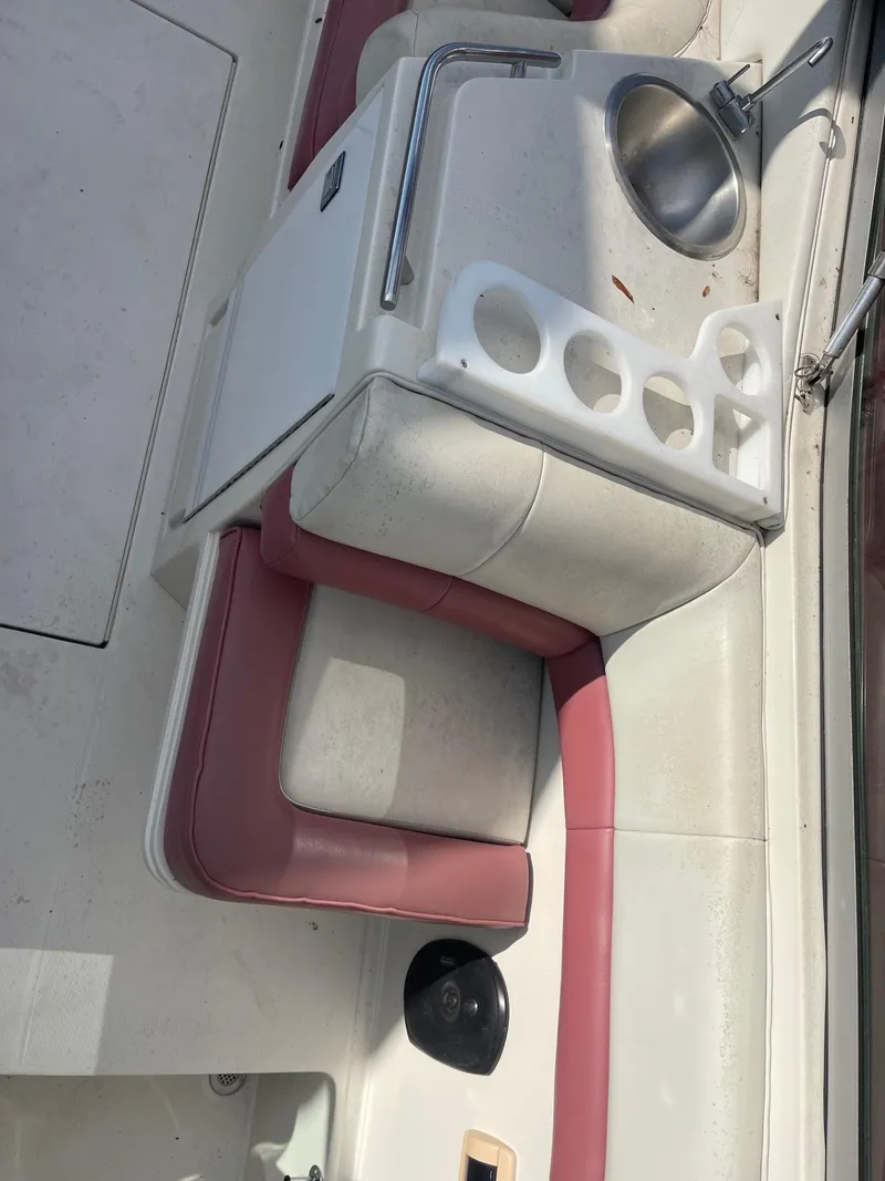 Slide: The Image of 1992 Regal Ventura boat interior with sink and seating area. - 9