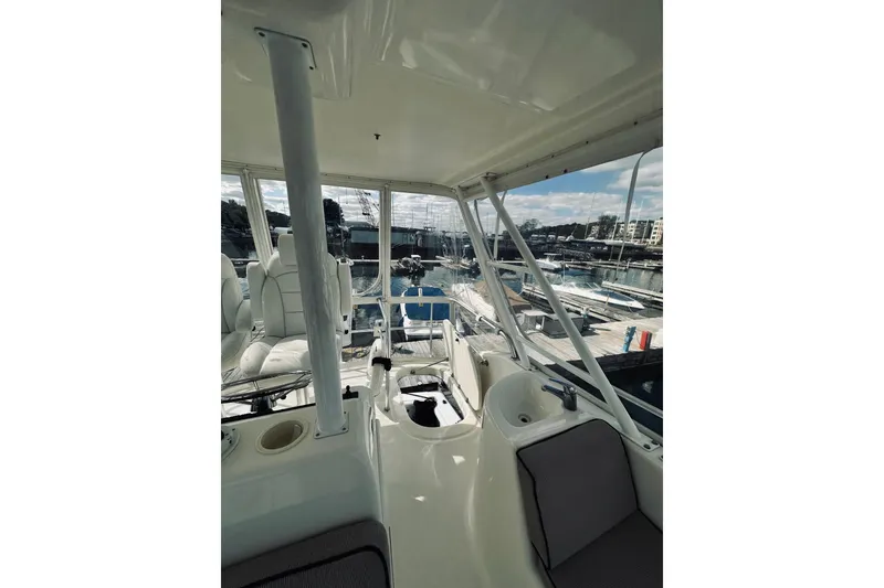 Slide: The Image of Interior of 2000 Riviera 40 yacht with cushioned seating and panoramic windows. - 17