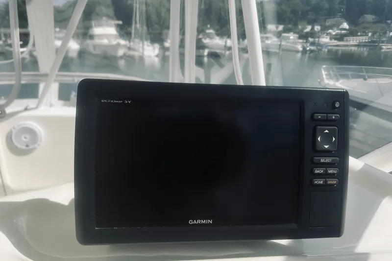 Slide: The Image of Simrad marine electronics on a 2000 Riviera 40 yacht dashboard. - 22