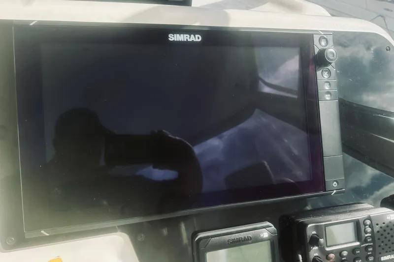 Slide: The Image of Interior view of a 2000 Riviera 40 yacht with marina background. - 23