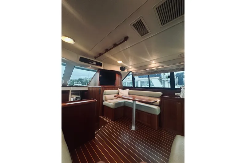 Slide: The Image of Interior of 2000 Riviera 40 yacht with cozy seating and elegant decor. - 29