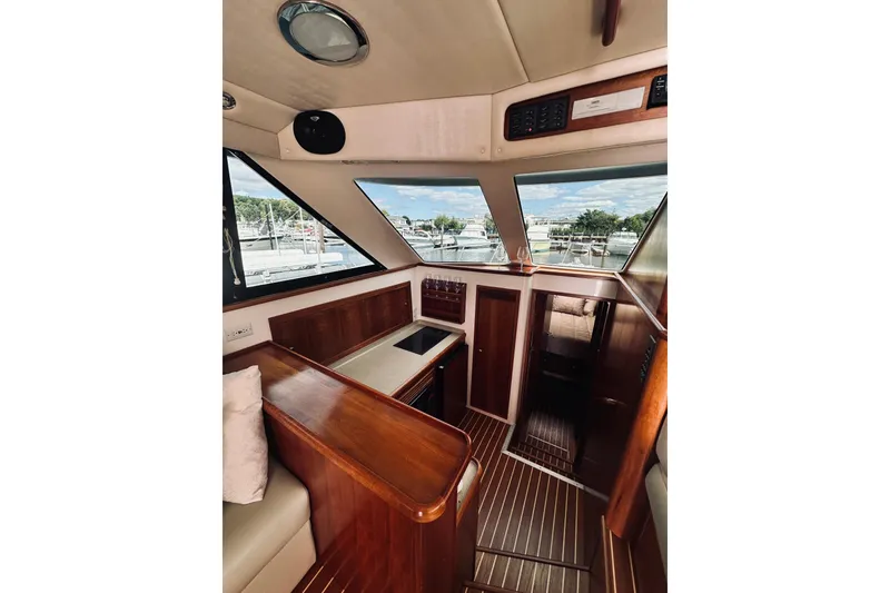 Slide: The Image of Interior of 2000 Riviera 40 yacht with wood finishes and large windows. - 36