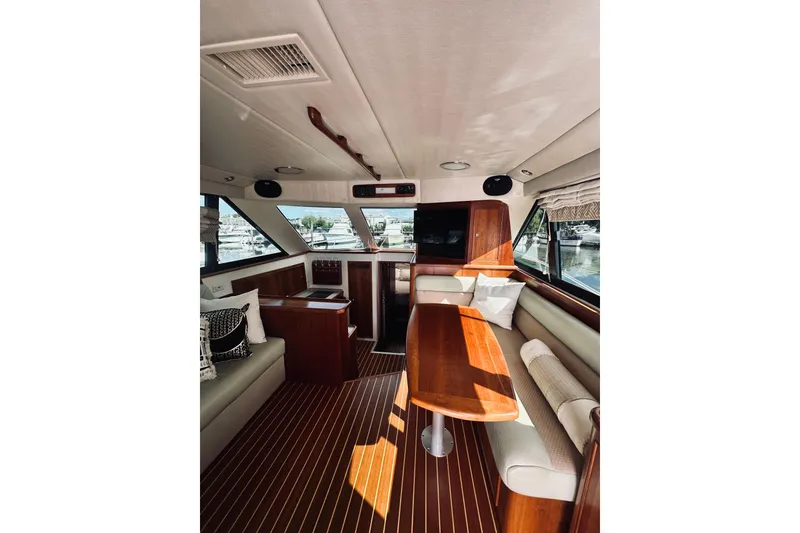 Slide: The Image of Interior view of 2000 Riviera 40 yacht cabin with bed and bathroom. - 40