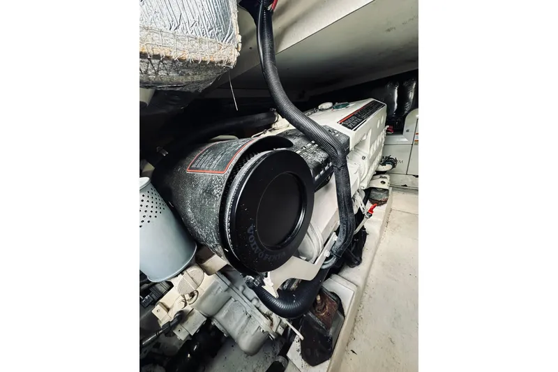 Slide: The Image of Engine room of a 2000 Riviera 40 boat, featuring dual engines and mechanical components. - 59