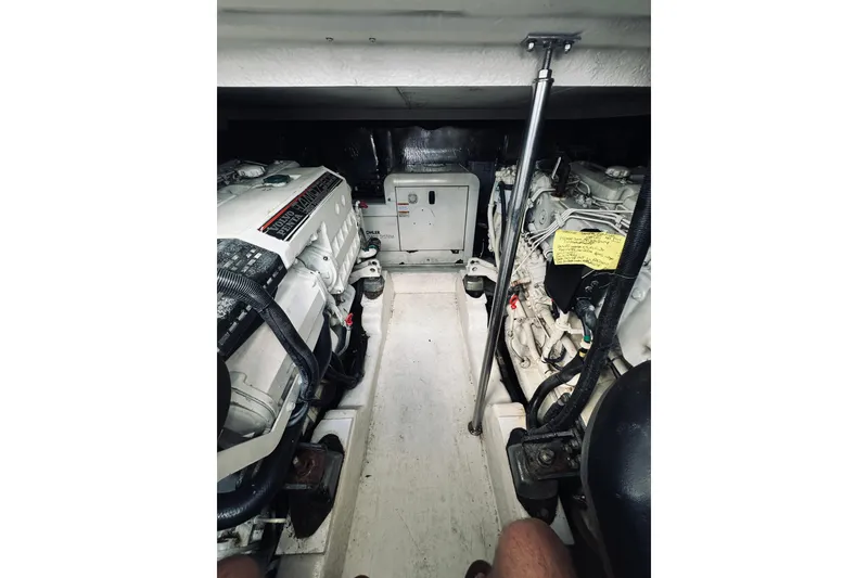 Slide: The Image of Engine room of 2000 Riviera 40 yacht, showcasing detailed mechanical components. - 60