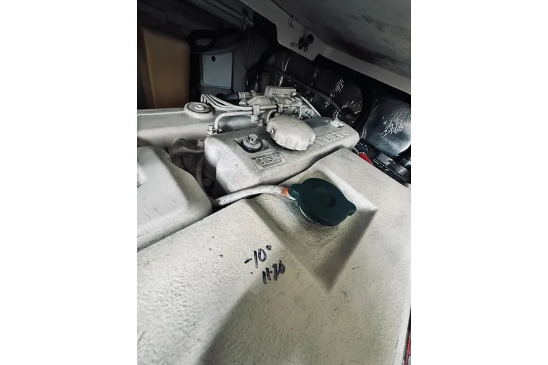 Slide: The Image of Engine compartment of a 2000 Riviera 40 boat, featuring a Volvo diesel engine. - 68