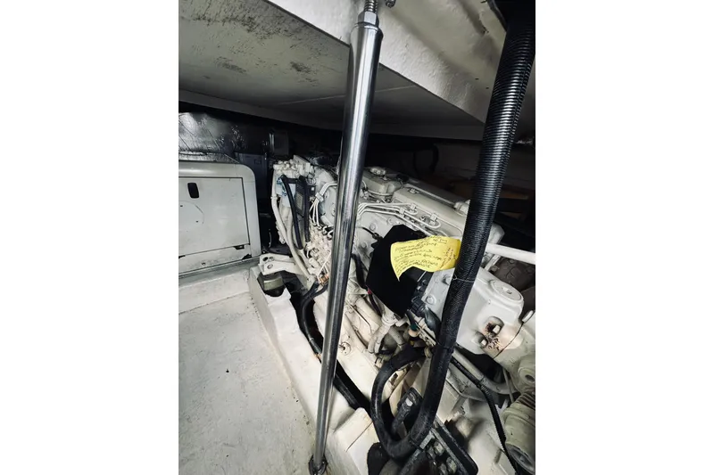 Slide: The Image of Engine of a 2000 Riviera 40 boat, featuring Volvo components and intricate wiring. - 73