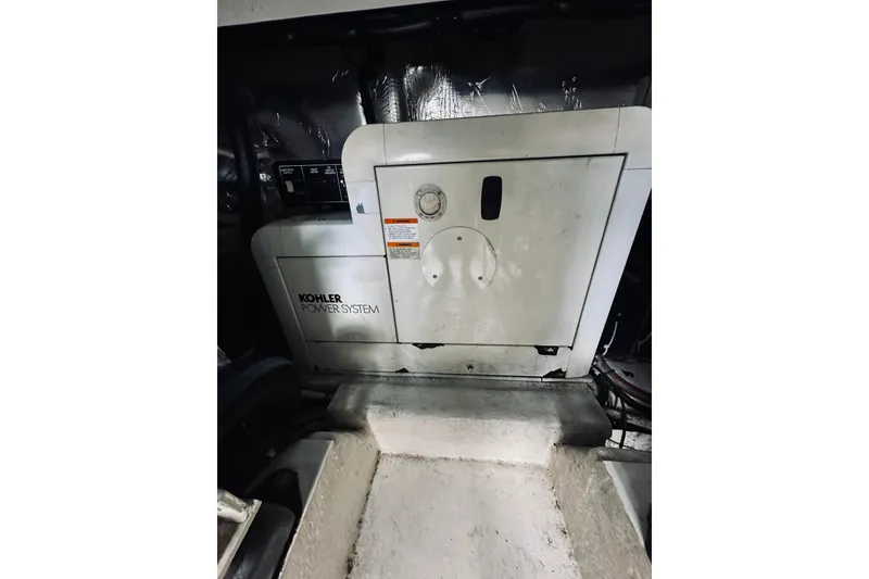 Slide: The Image of Control panel of a 2000 Riviera 40 with hour meter and circuit breakers. - 85