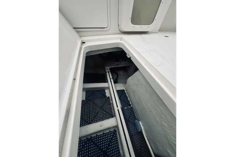Slide: The Image of Interior view of a 2000 Riviera 40 boat compartment with storage space. - 88