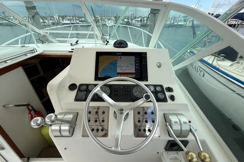 Slide: The Image of Helm of 1998 Cabo 31 Express boat with navigation equipment and steering wheel. - 19