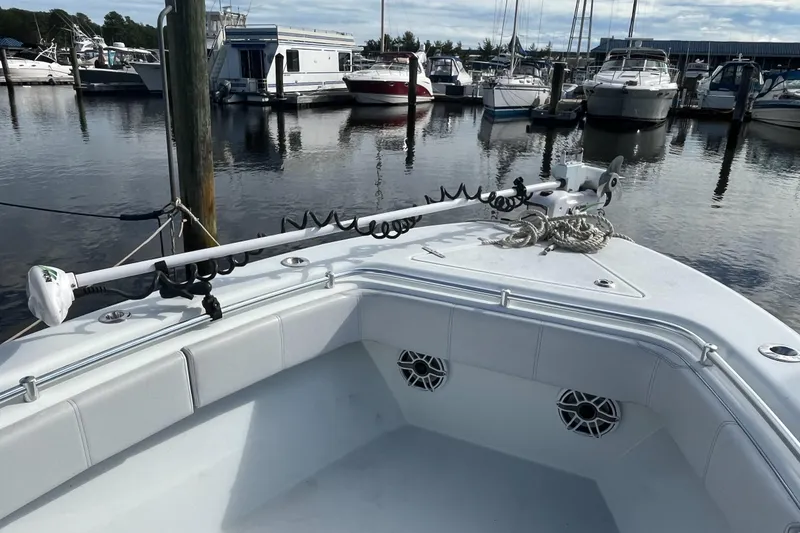 Slide: The Image of 2023 Contender 28 Tournament boat docked in marina, featuring modern design and equipment. - 6