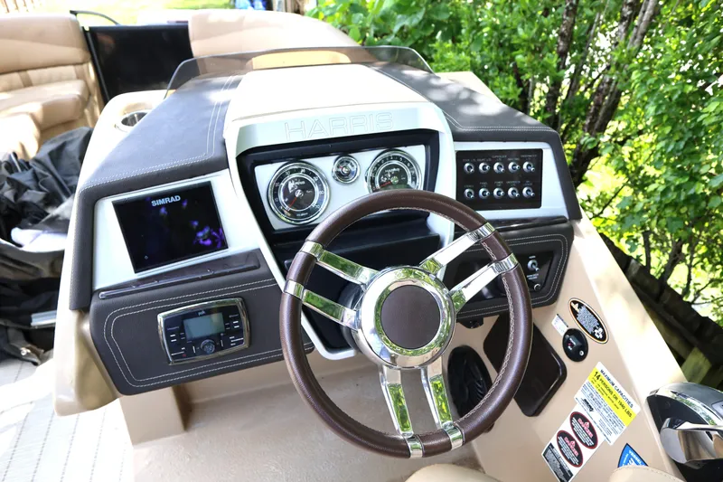 Slide: The Image of 2019 Harris Grand Mariner 250 dashboard with steering wheel and control panel. - 18