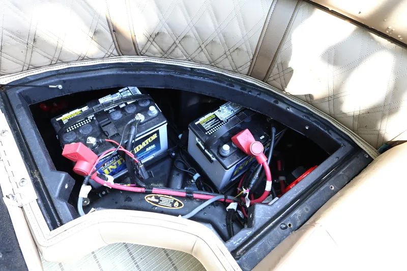 Slide: The Image of Battery compartment of 2019 Harris Grand Mariner 250 boat, featuring dual batteries. - 20