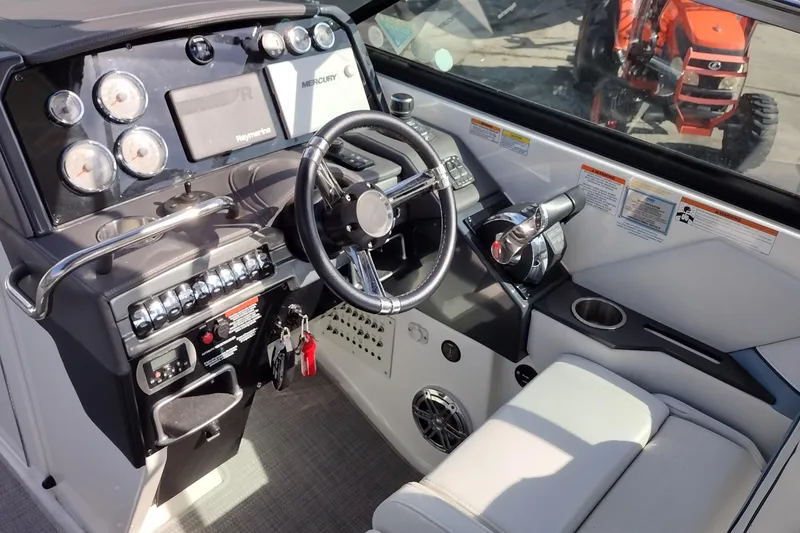 Slide: The Image of 2019 Formula 310 Bowrider dashboard with steering wheel, gauges, and control panel. - 13
