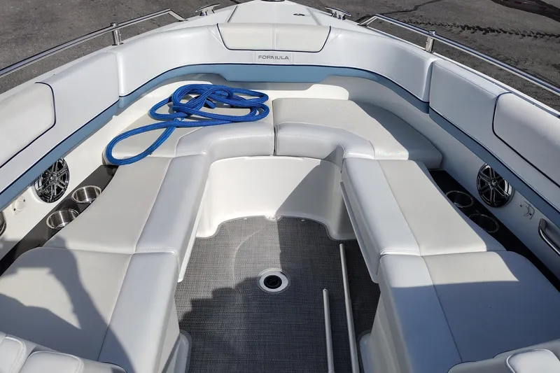 Slide: The Image of 2019 Formula 310 Bowrider interior with white seating and blue rope on deck. - 19