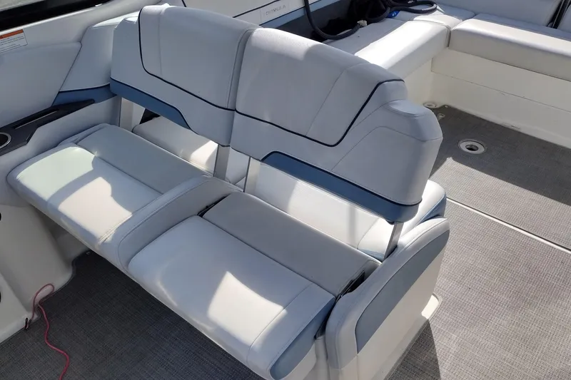 Slide: The Image of 2019 Formula 310 Bowrider interior seating with gray upholstery and blue accents. - 23