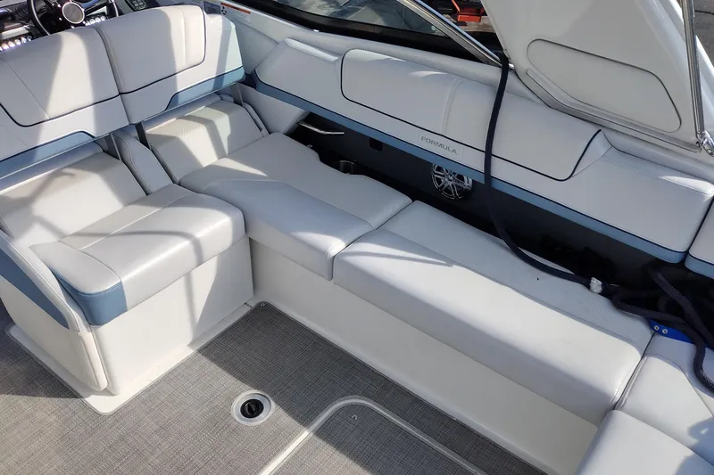 Slide: The Image of 2019 Formula 310 Bowrider interior with white seating and modern design. - 29