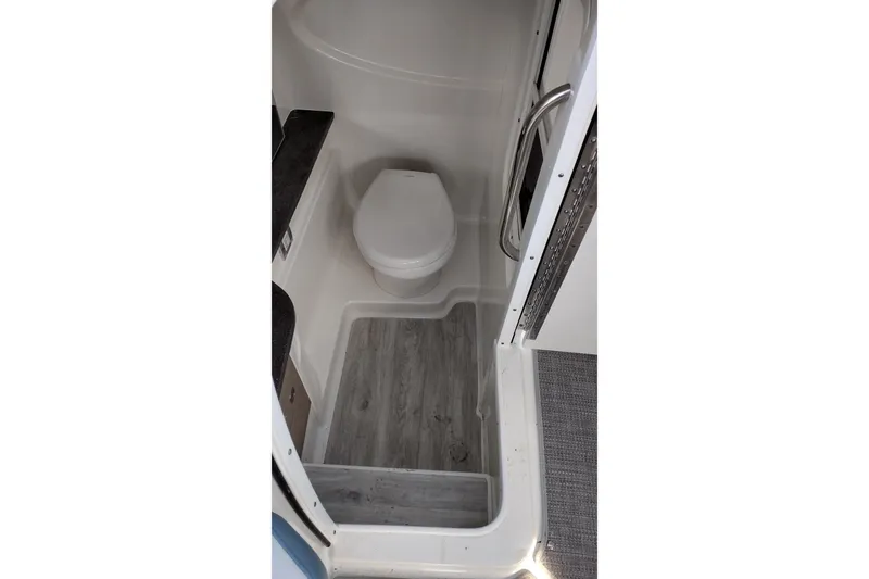 Slide: The Image of 2019 Formula 310 Bowrider bathroom interior with modern fixtures and wood-style flooring. - 31