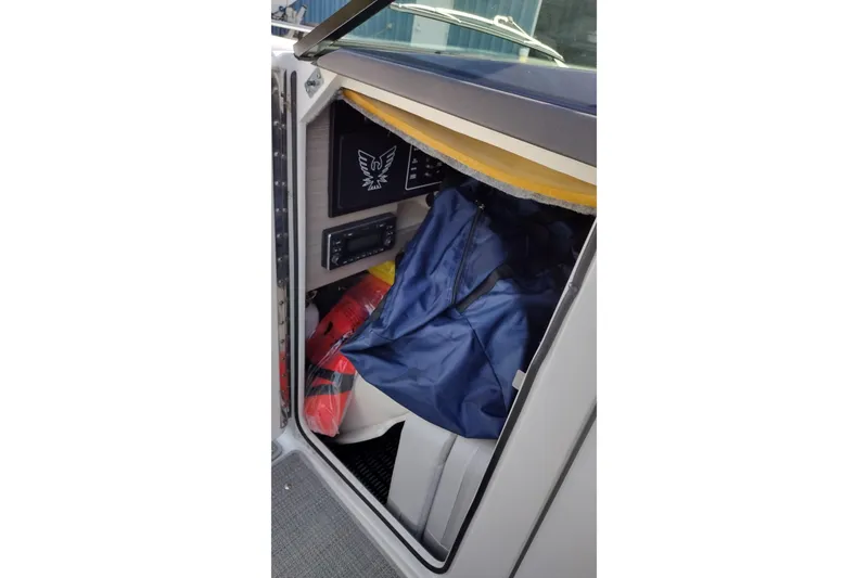 Slide: The Image of 2019 Formula 310 Bowrider storage compartment with life jackets and gear. - 33
