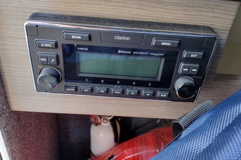 Slide: The Image of Clarion audio system in 2019 Formula 310 Bowrider boat dashboard. - 34