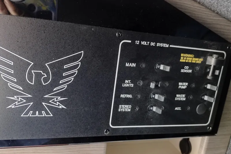 Slide: The Image of Control panel of a 2019 Formula 310 Bowrider boat's 12-volt DC system. - 35