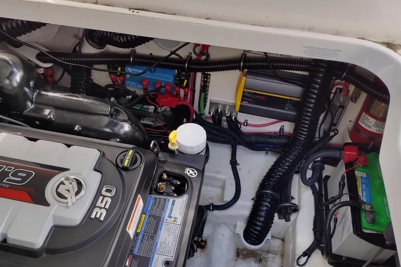 Slide: The Image of Engine compartment of a 2019 Formula 310 Bowrider with visible wiring and components. - 39