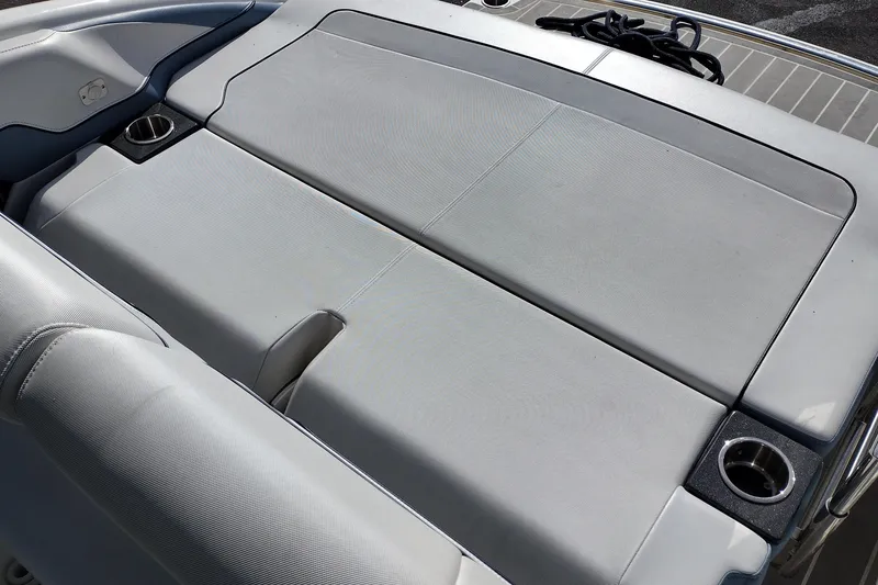 Slide: The Image of 2019 Formula 310 Bowrider boat interior with cushioned seating and cup holders. - 43