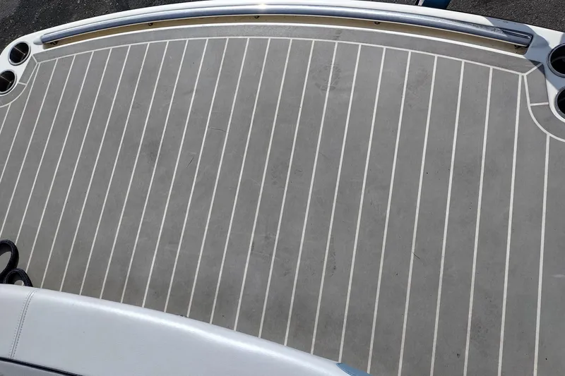 Slide: The Image of 2019 Formula 310 Bowrider swim platform with gray non-slip decking and cup holders. - 45