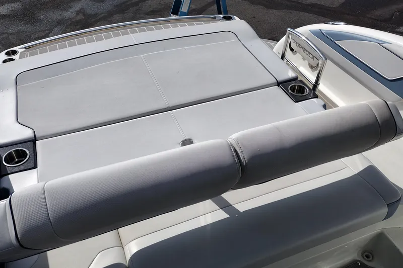Slide: The Image of 2019 Formula 310 Bowrider boat with spacious seating and cup holders. - 47