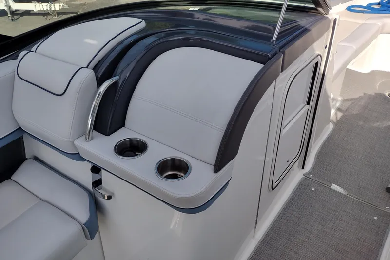 Slide: The Image of 2019 Formula 310 Bowrider interior with cup holders and sleek seating design. - 50