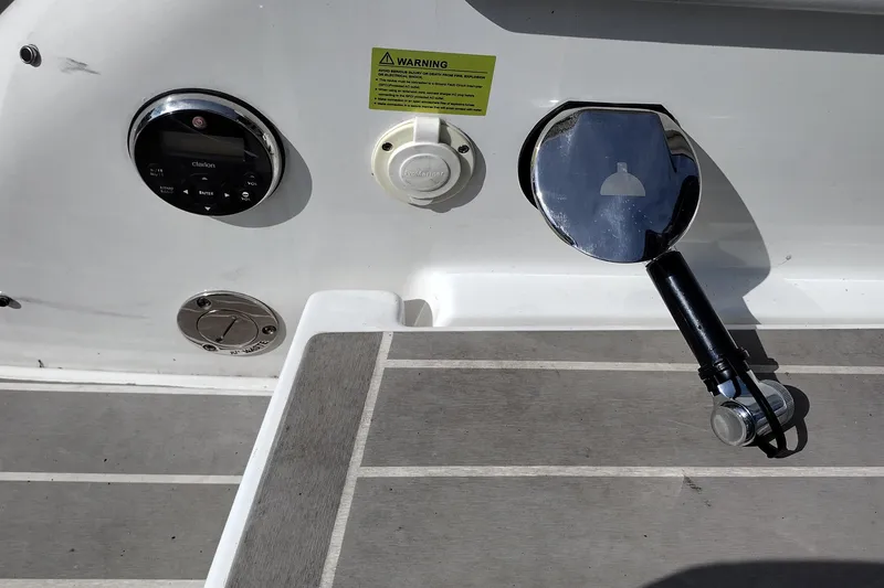 Slide: The Image of 2019 Formula 310 Bowrider boat deck with controls and shower handle. - 51