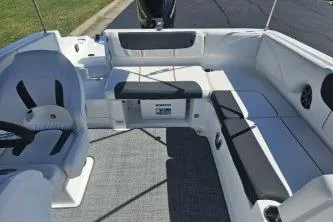 Slide: The Image of 2024 Tahoe 2150 boat interior with spacious seating and modern design. - 11