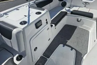 Slide: The Image of 2024 Tahoe 2150 boat interior with seating, storage, and cup holders. - 8