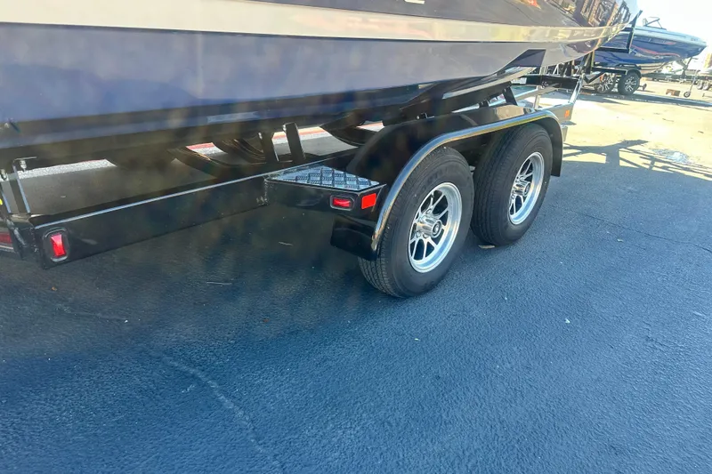 Slide: The Image of 2012 Regal 24 FasDeck boat interior with beige and white seating. - 12