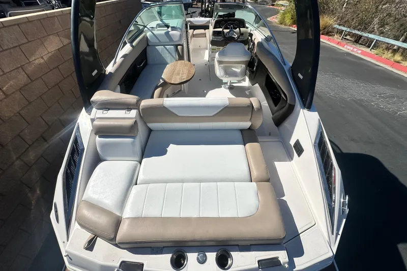 Slide: The Image of Speakers on a 2012 Regal 24 FasDeck boat under a blue canopy. - 13